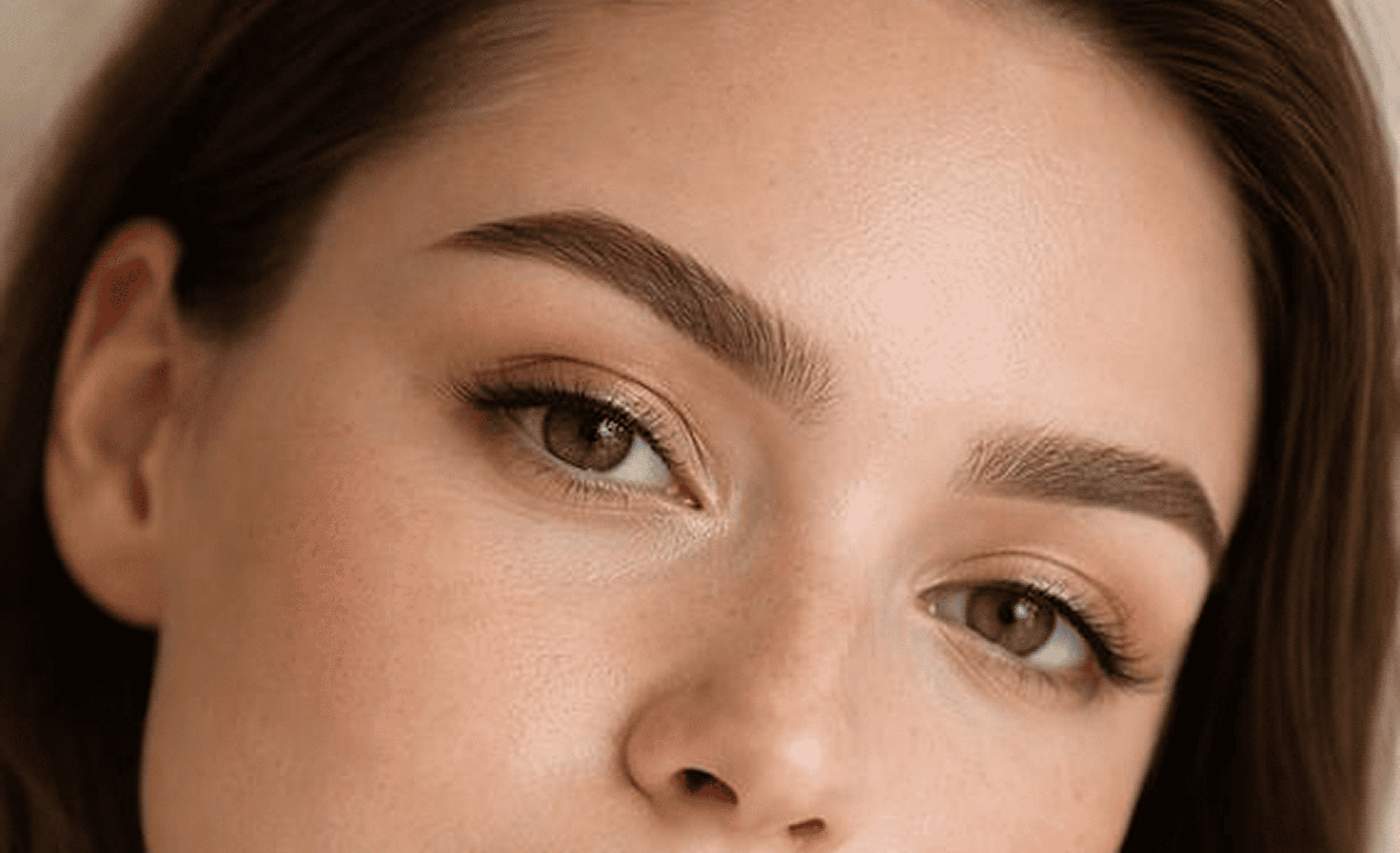 Close-up of a woman's face, neutral expression.